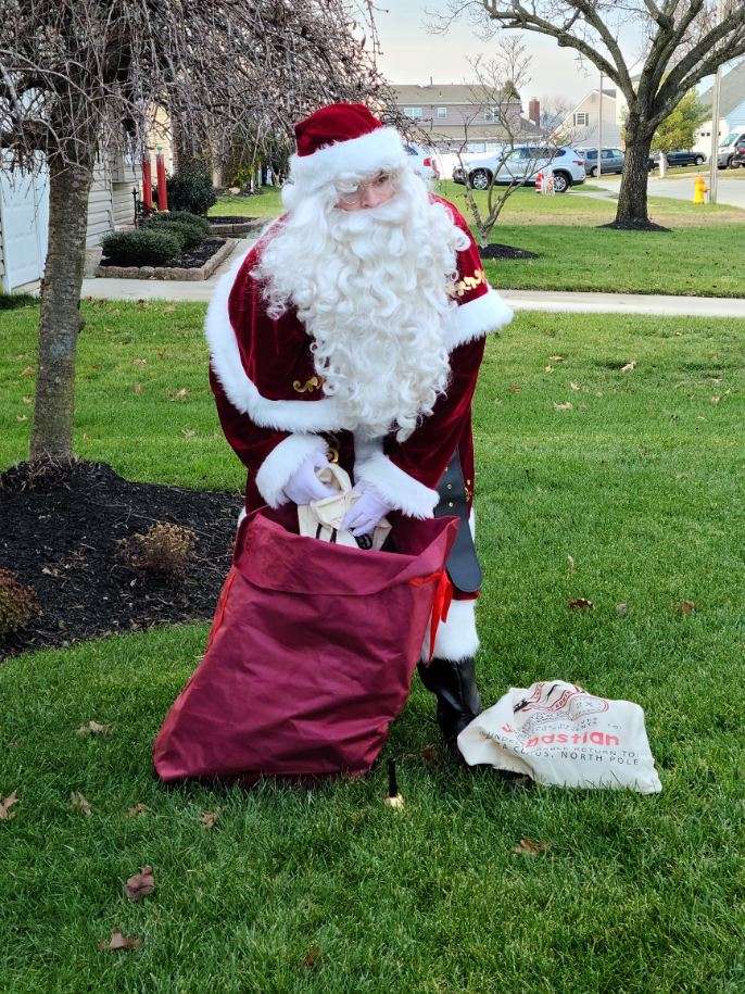 Santa making home delivery visits outside